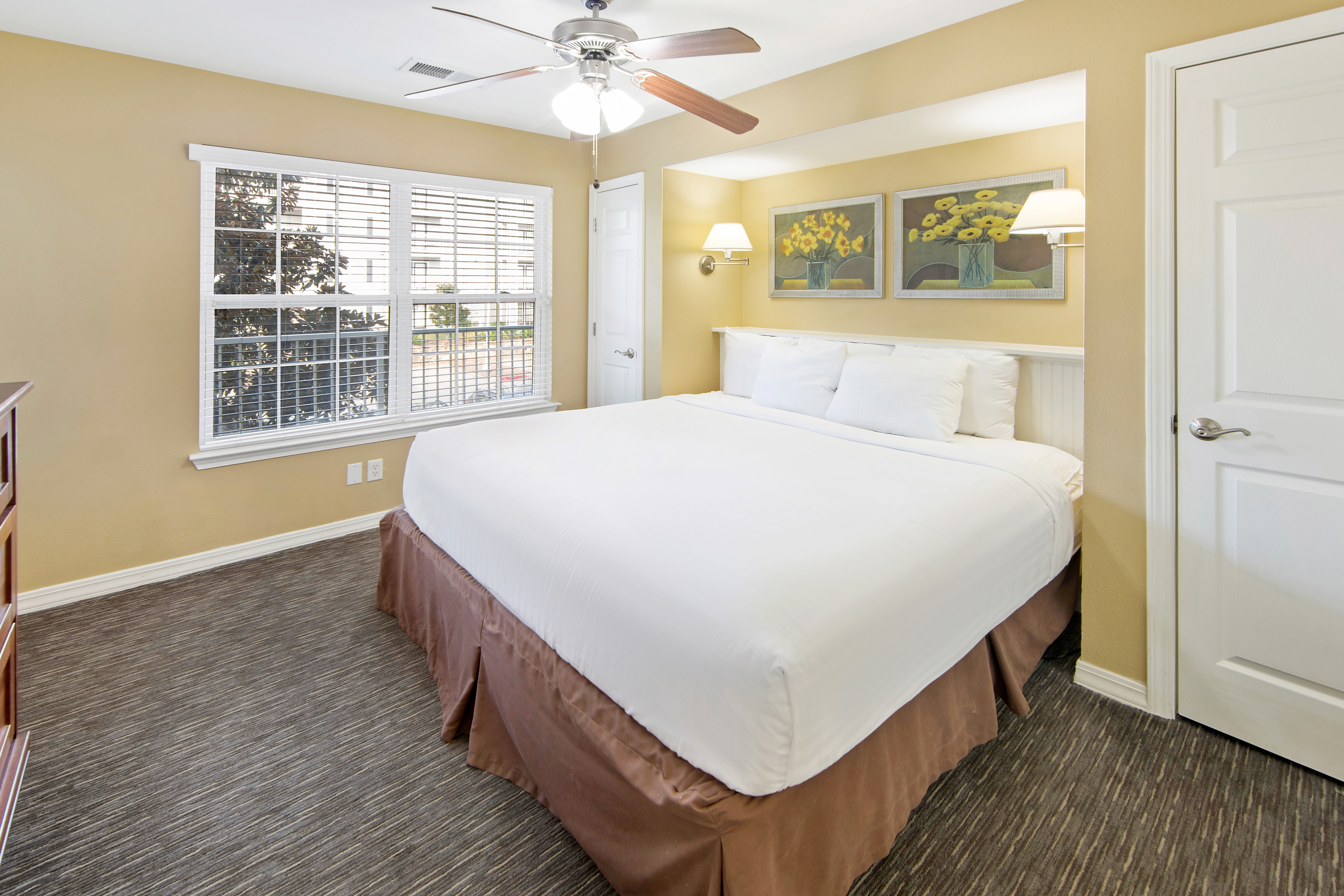 King bed in a one-bedroom villa at Holiday Hills Resort at Branson in Branson, MO.