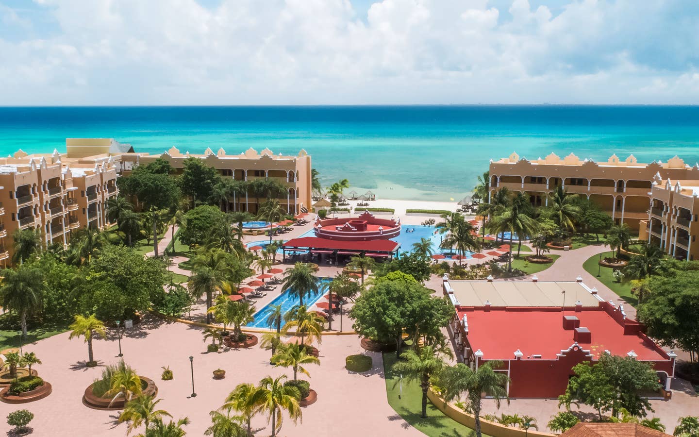 Aerial view of resort villas, outdoor pools and the ocean at The Royal Haciendas in Playa del Carmen, Mexico.
