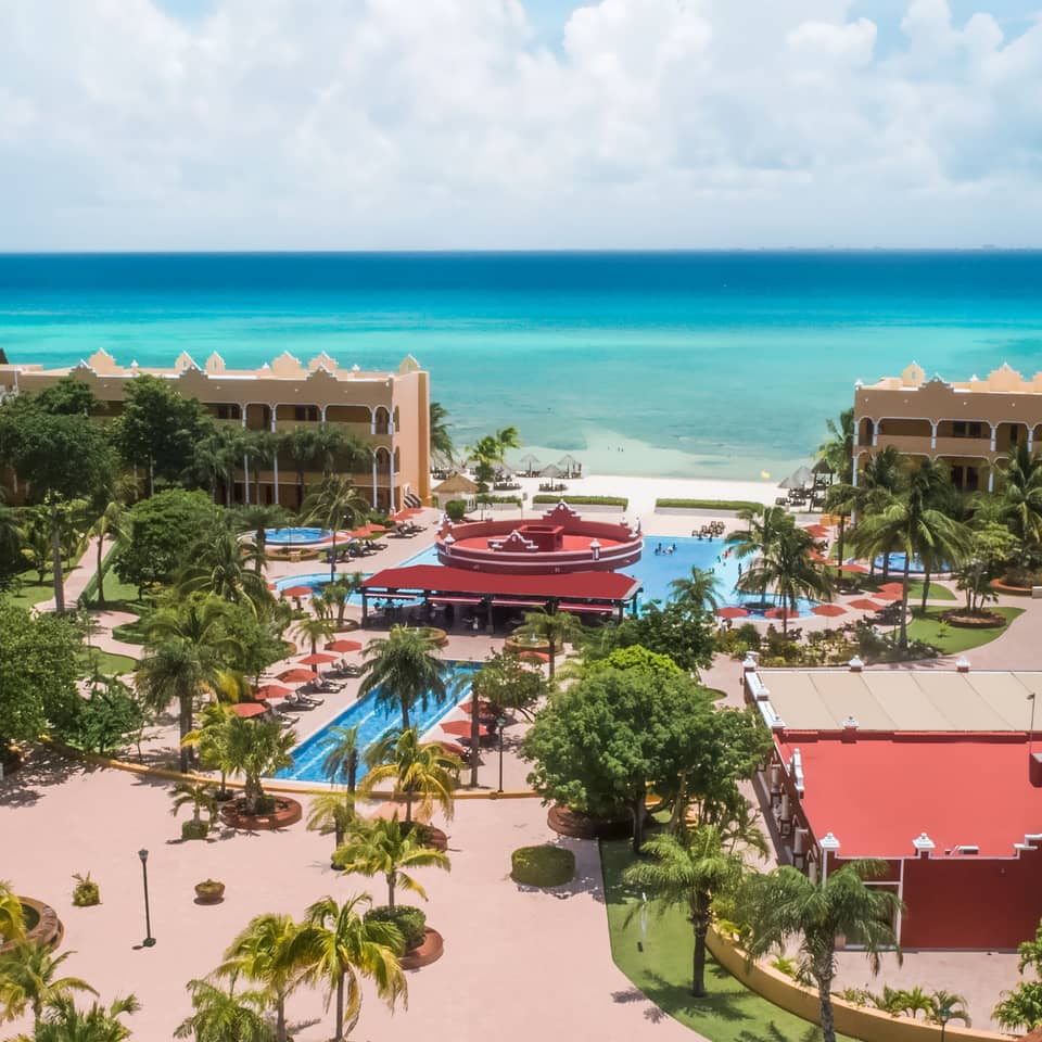 Aerial view of resort villas, outdoor pools and the ocean at The Royal Haciendas in Playa del Carmen, Mexico.
