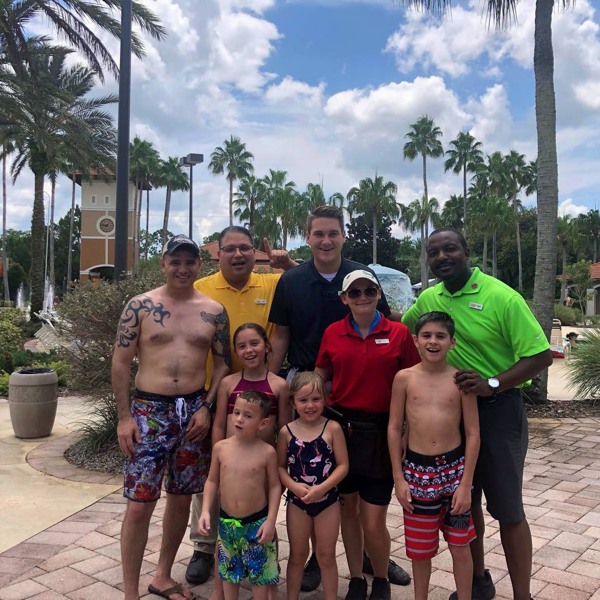 Featured Member, Sara Perezes family stands with HICV Team Members outside of our River Island pool.