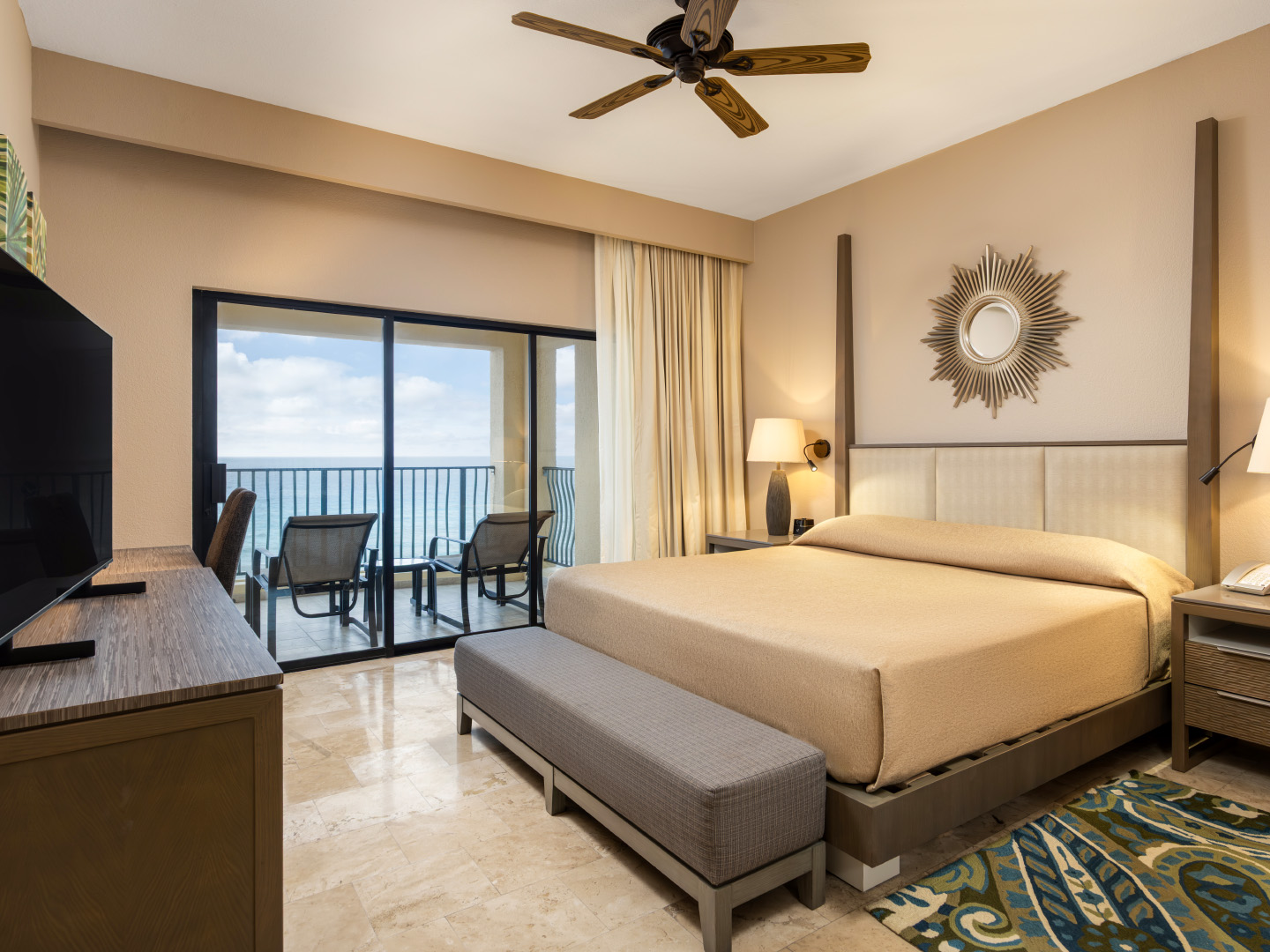 Peaceful master bedroom with ocean views and modern décor.
