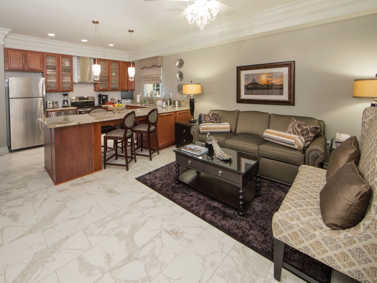 Living room and kitchen in a Signature Collection villa at Williamsburg Resort