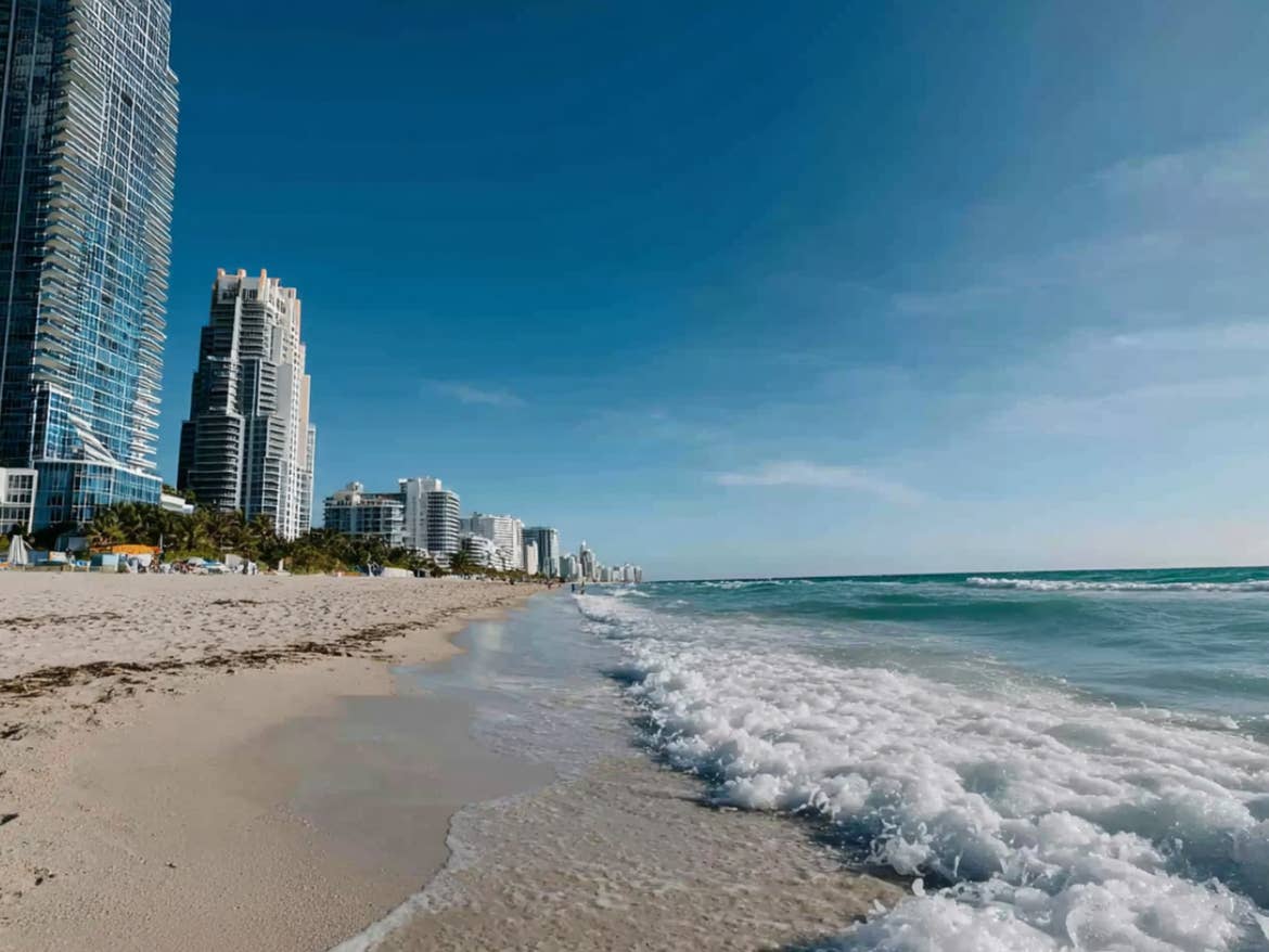 Buildings and beach along the shoreline in Miami.