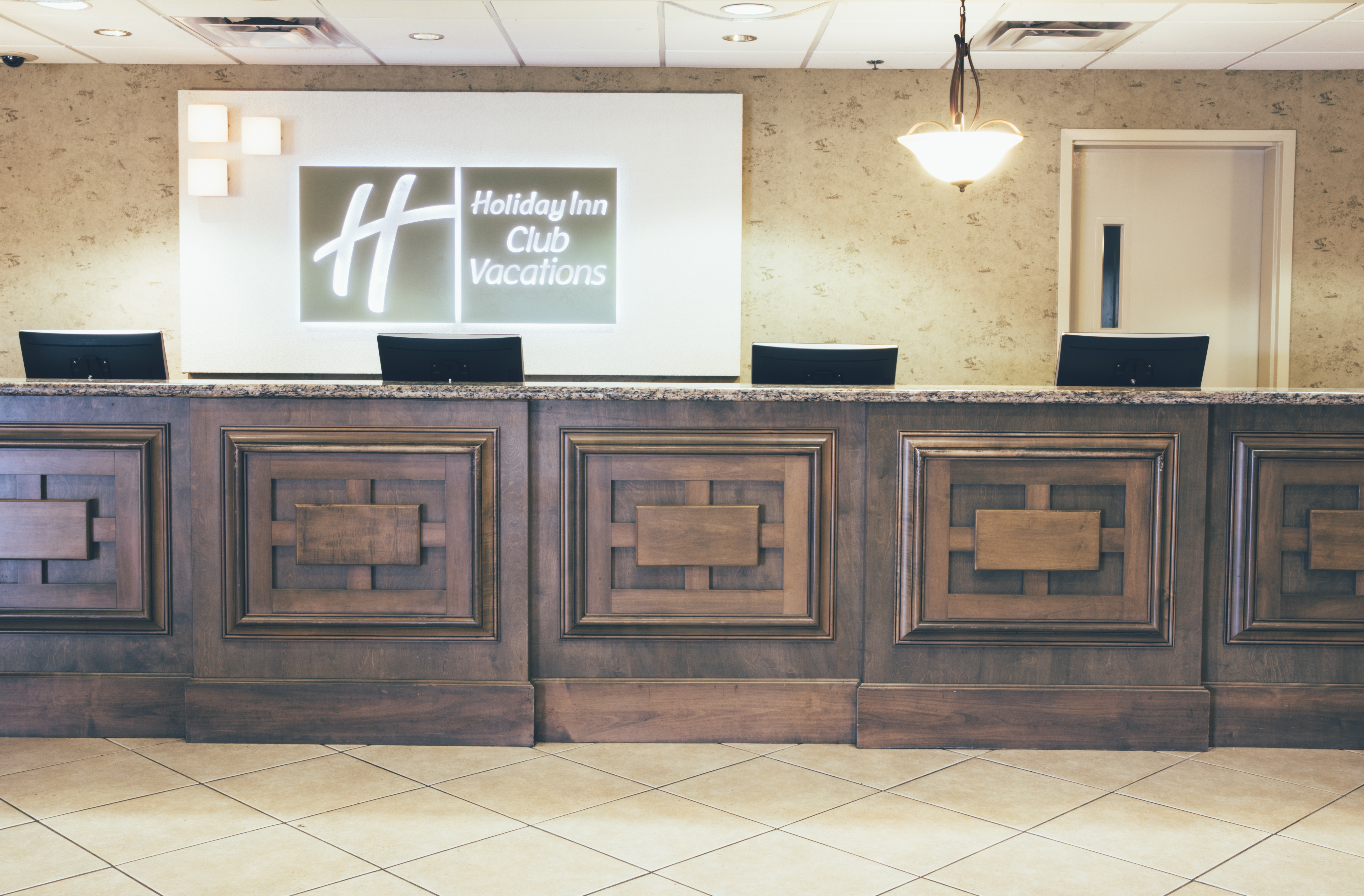 Front desk and reception in lobby of West Village at Orange Lake Resort near Orlando, Florida.