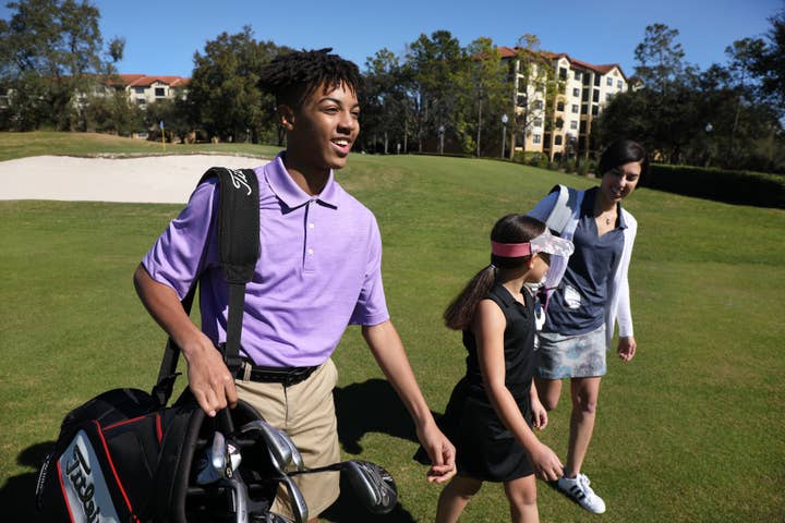 Golfers walking on course at Orange Lake Resort near Orlando, Florida