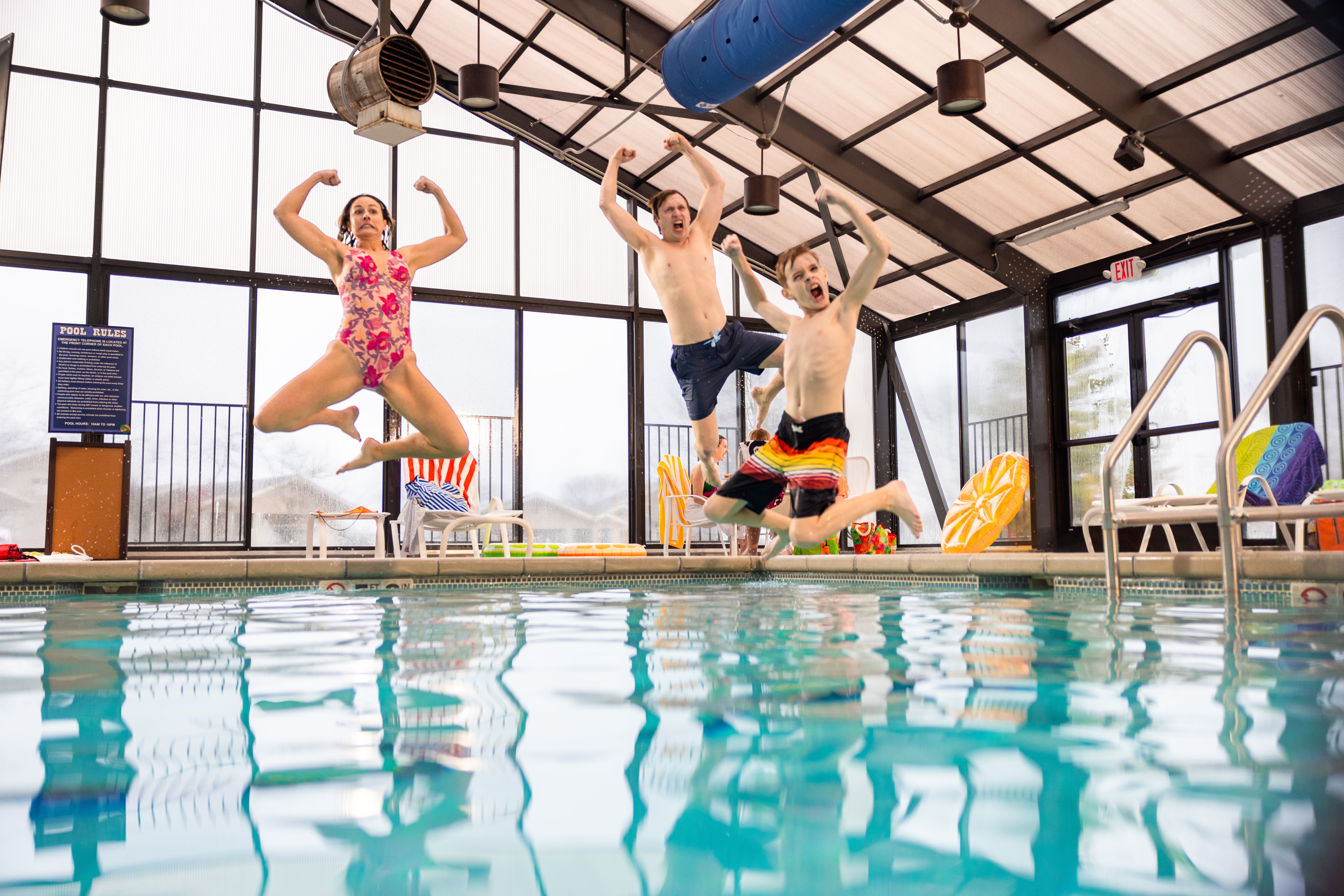 Family having fun in the indoor pool at Holiday Hills Resort, Branson