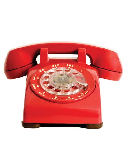 An old red rotary phone