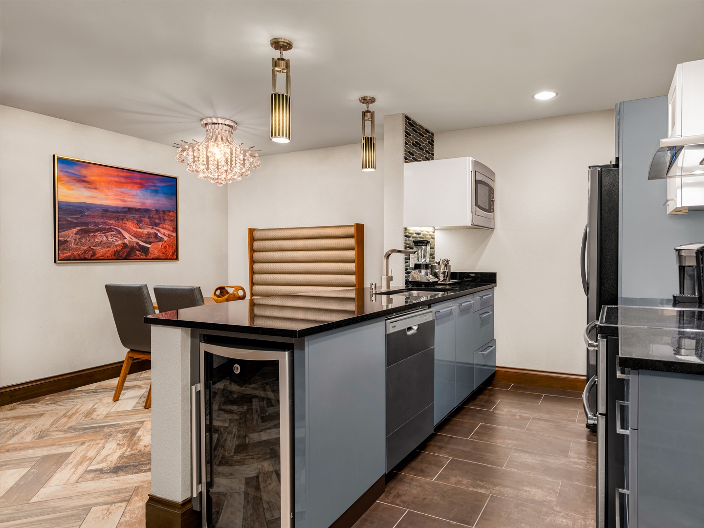 Modern kitchen and dining area with stone accents.
