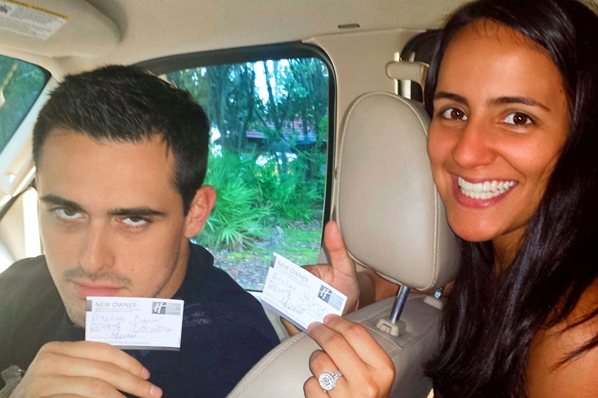 Author, Danny Pitaluga (left), looks quite displeased as he and his wife, Val (right), gives a thumbs up inside their parent's car holding their Holiday Inn Club Vacations Membership Cards.