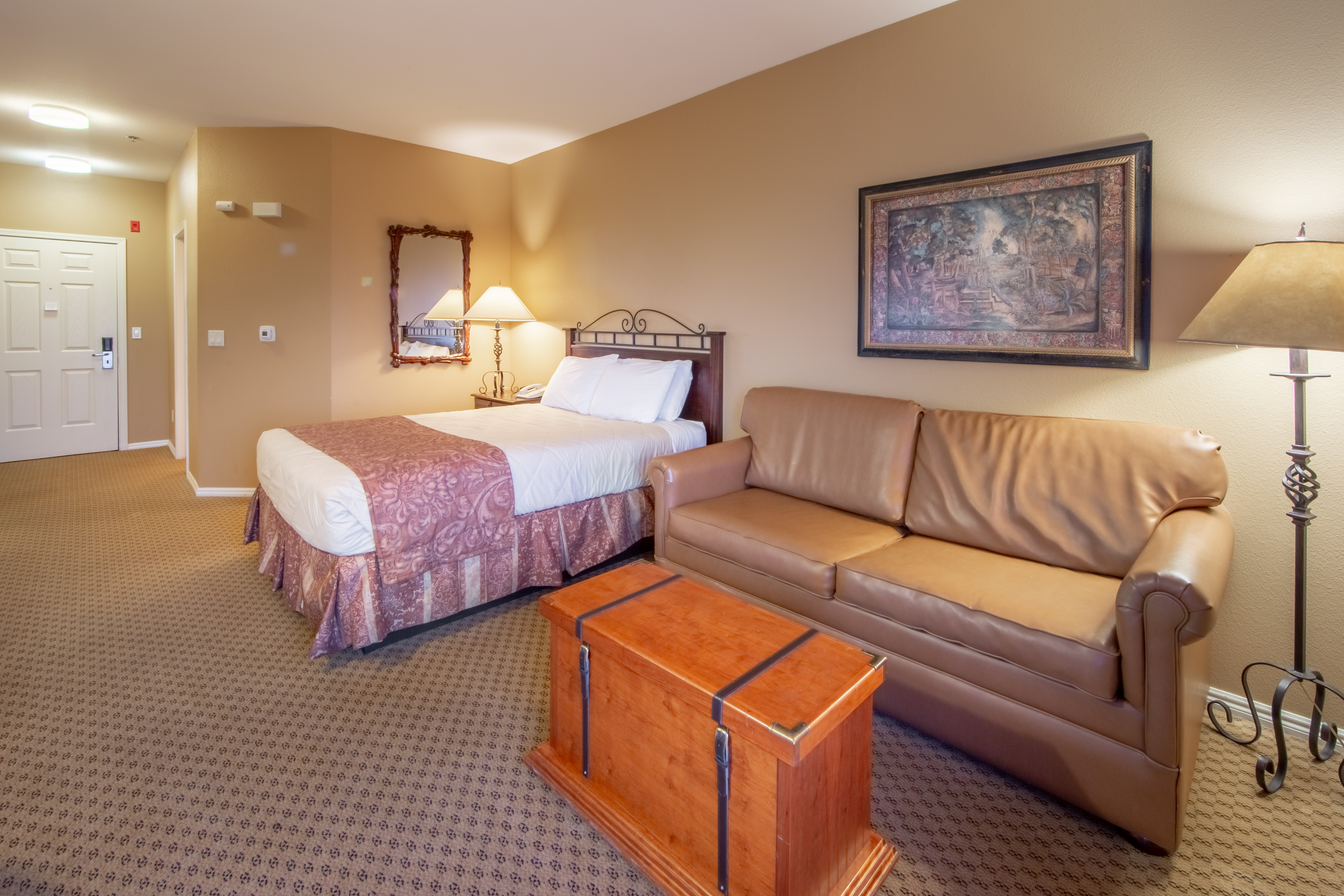 One queen bed and a sleeper sofa in a studio room at David Walley's Resort in Genoa, Nevada