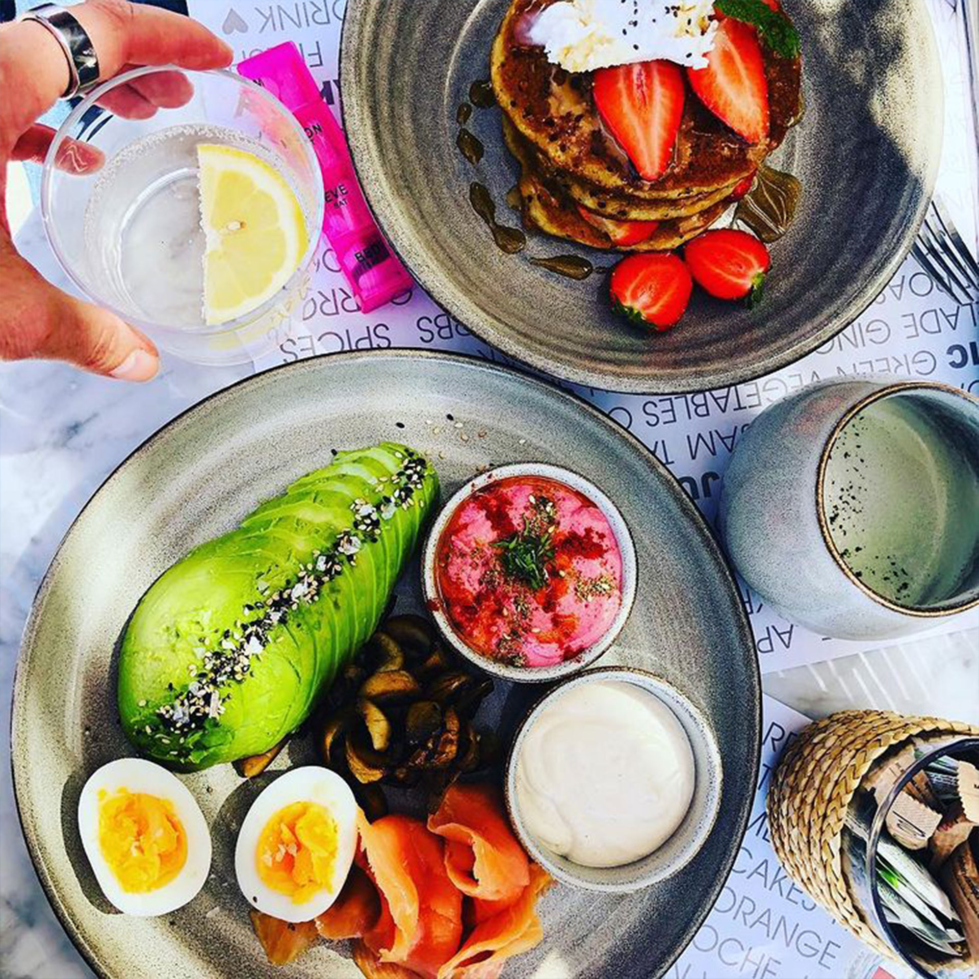 Colorful plates full of fruits, veggies and food.