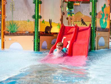Child going down waterslide