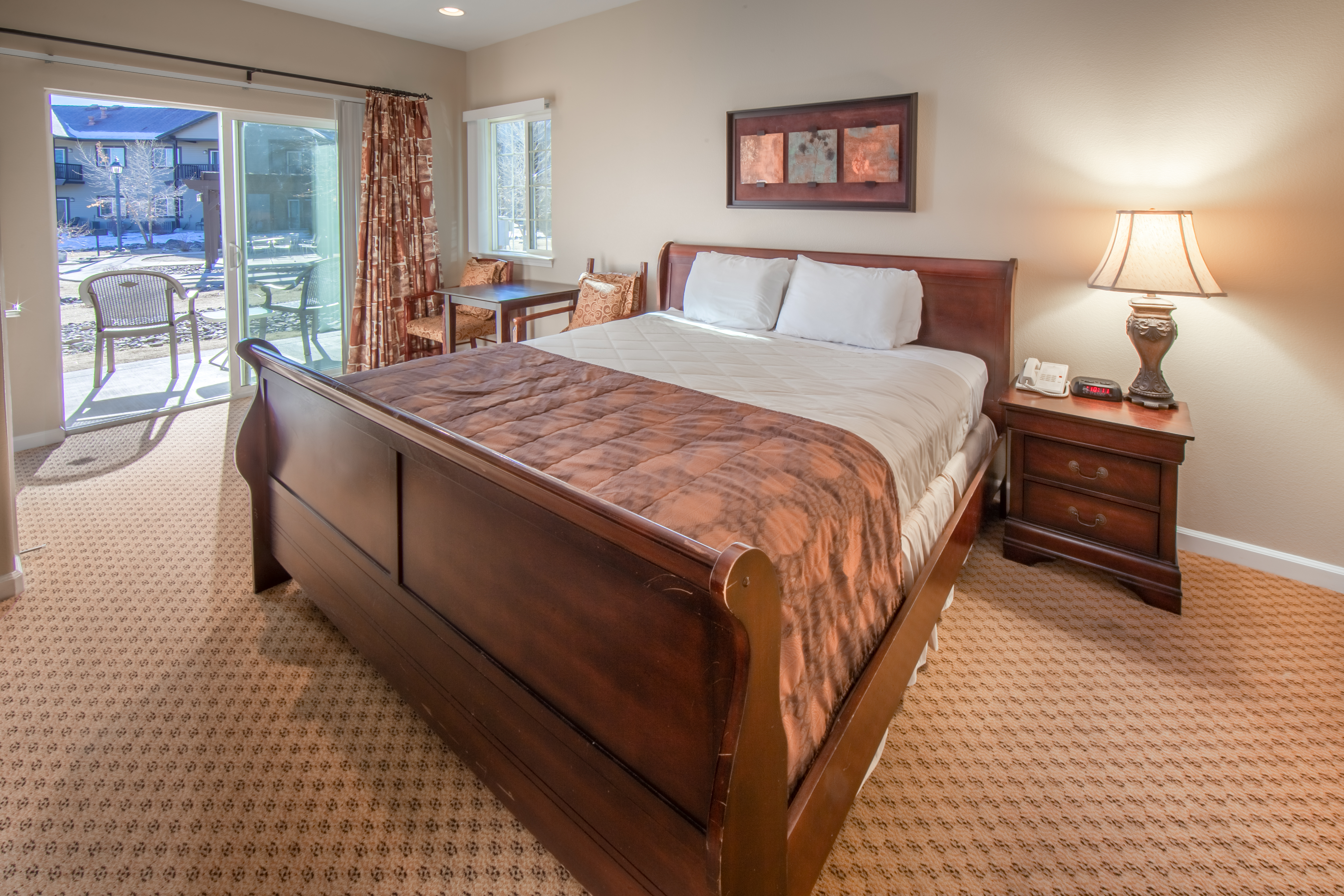 Bedroom with attached patio in a two-bedroom villa at David Walley's Resort in Genoa, Nevada