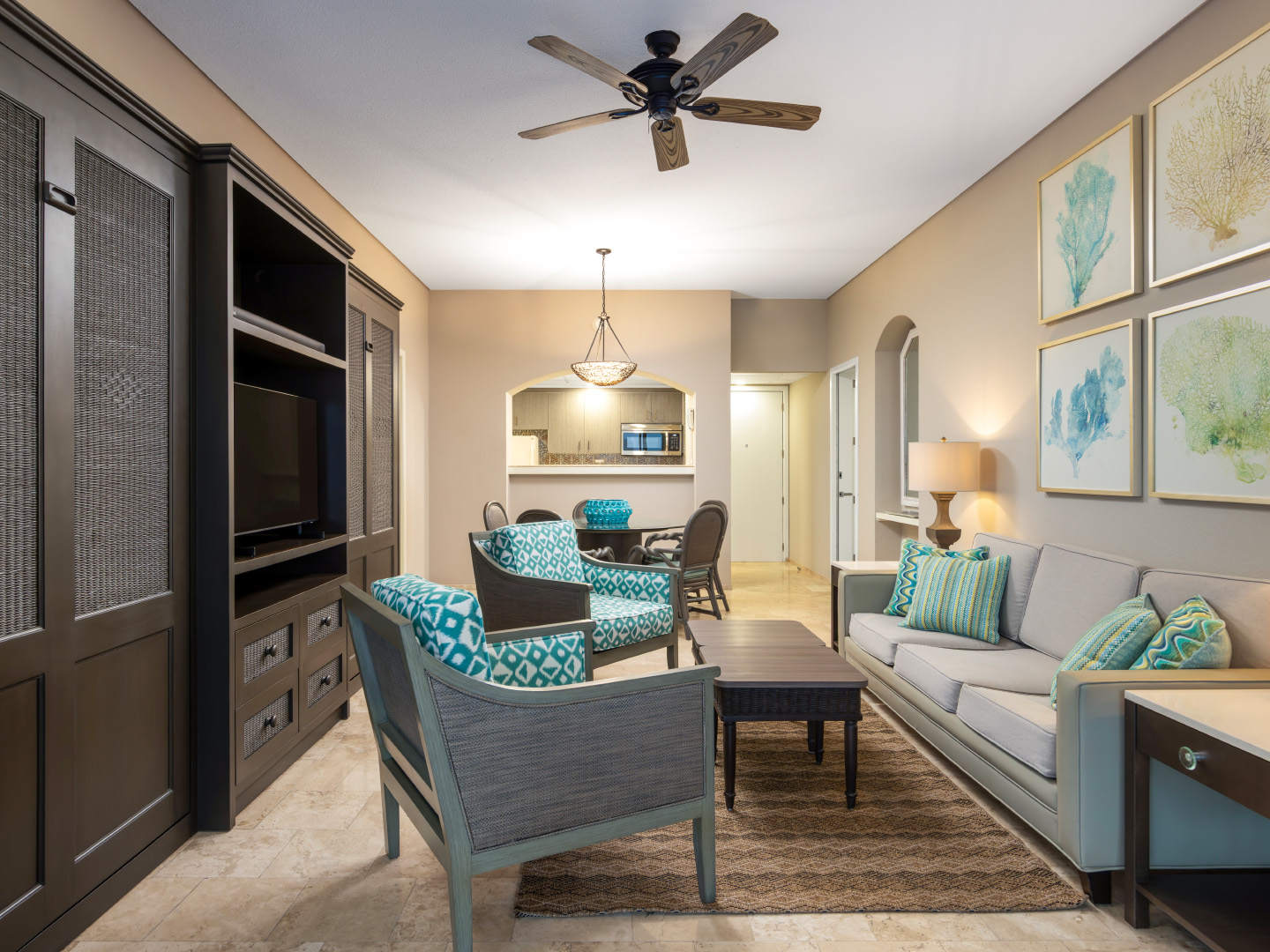 Spacious living room with seating and coastal décor.