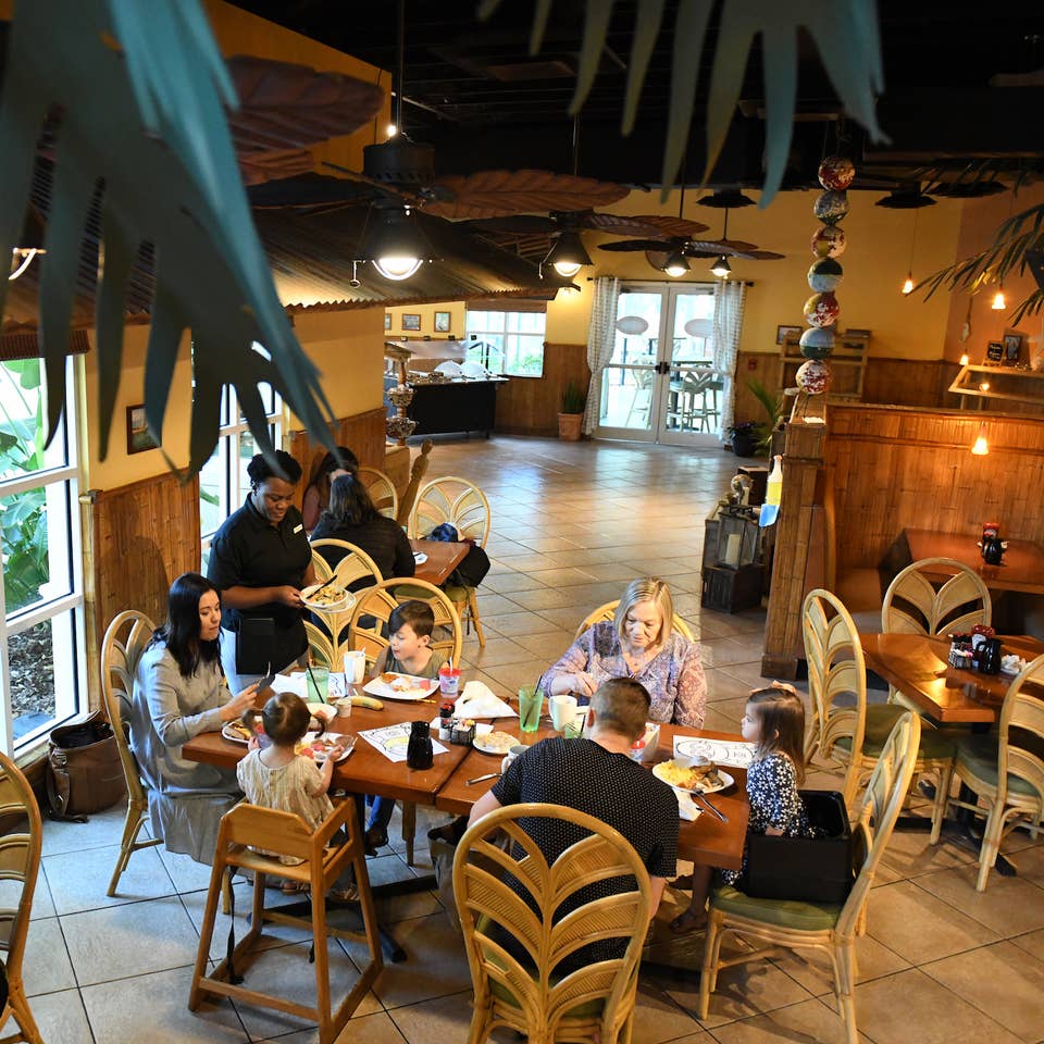 Family eating at River Island Grilling Company at Orange Lake Resort near Orlando, Florida.