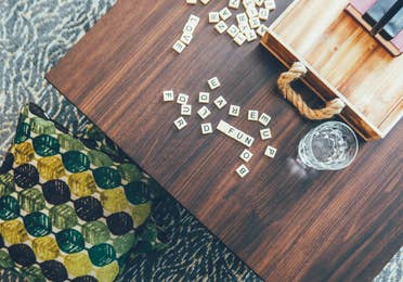 Closeup of coffee table with Scrabble pieces in a villa in River Island at Orange Lake Resort near Orlando, Florida
