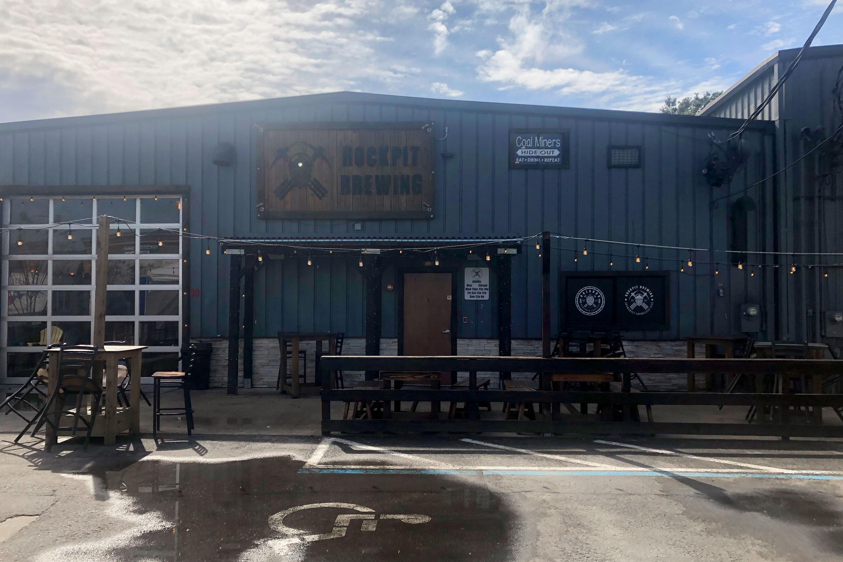 Exterior and outdoor dining space of 'Rockpit Brewing.'