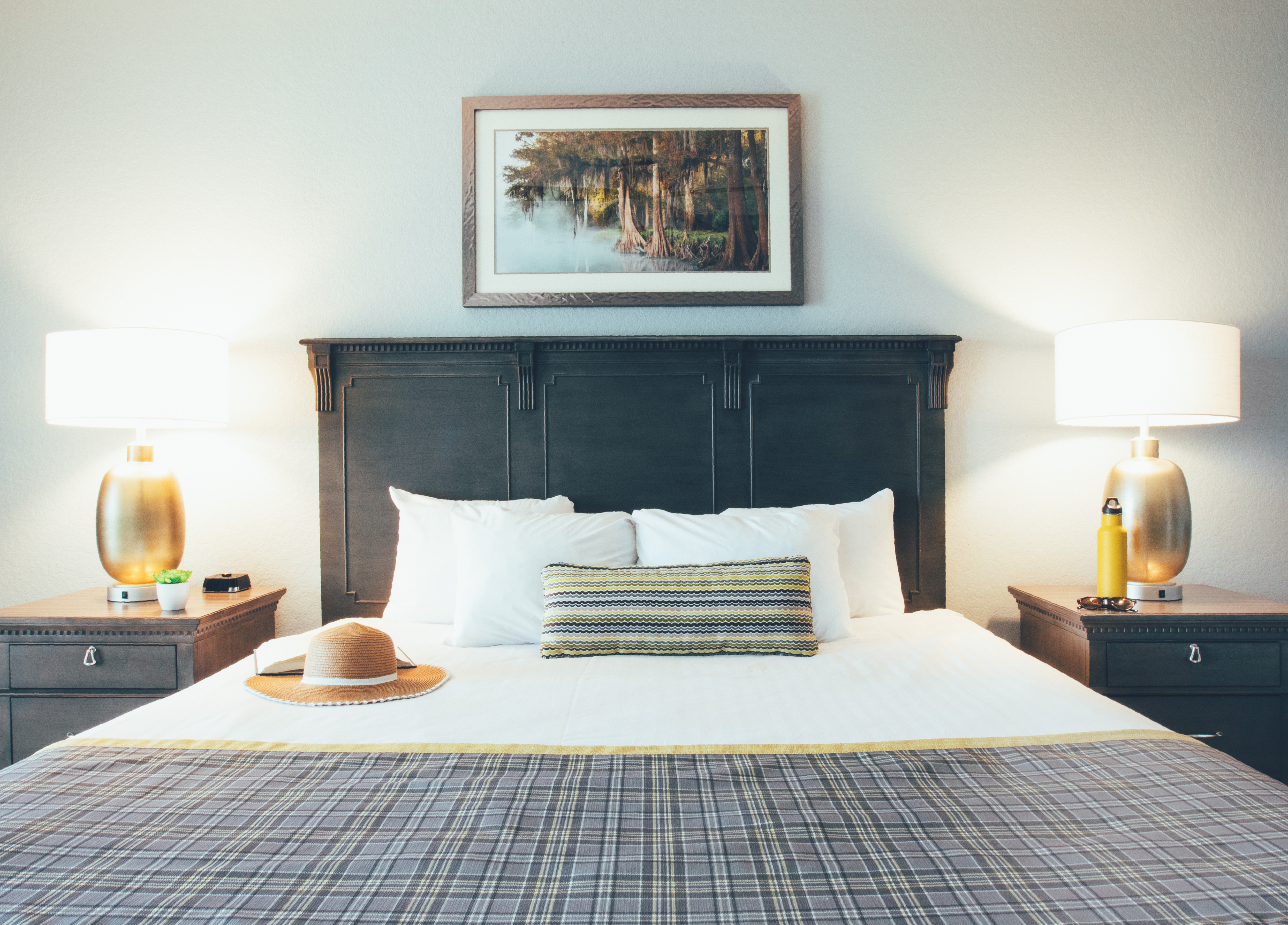 Closeup of bed with two nightstands in a villa in River Island at Orange Lake Resort near Orlando, Florida