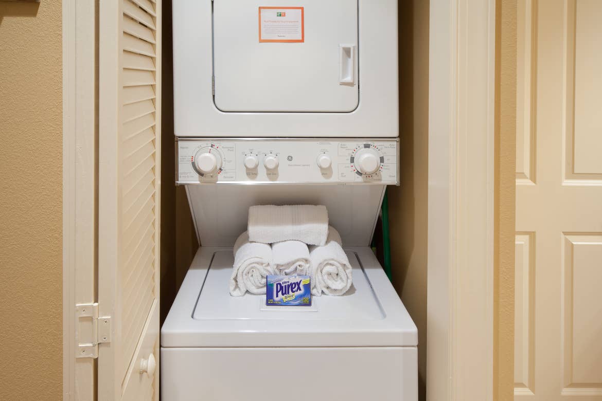 Stacked washer and dryer unit in our two-bedroom villa at Smoky Mountain Resort.