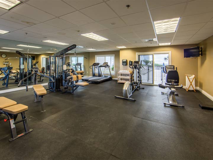 Fitness center with treadmills, ellipticals and stationary bicycles at Galveston Beach Resort in Texas.