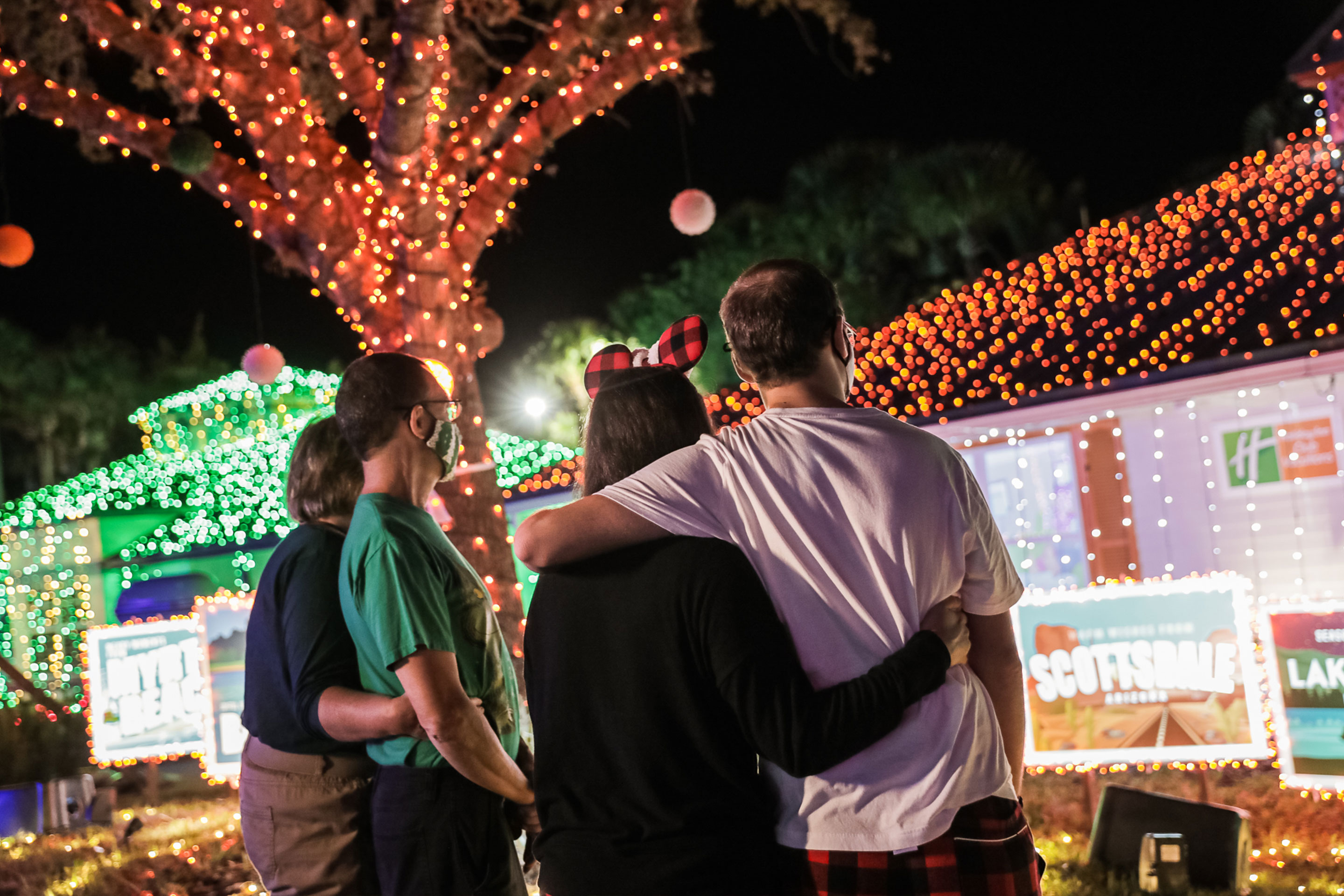A former 'Make-a-Wish' child, Kyle Bergen (right) and his family pose in front of our HICV villa exterior.