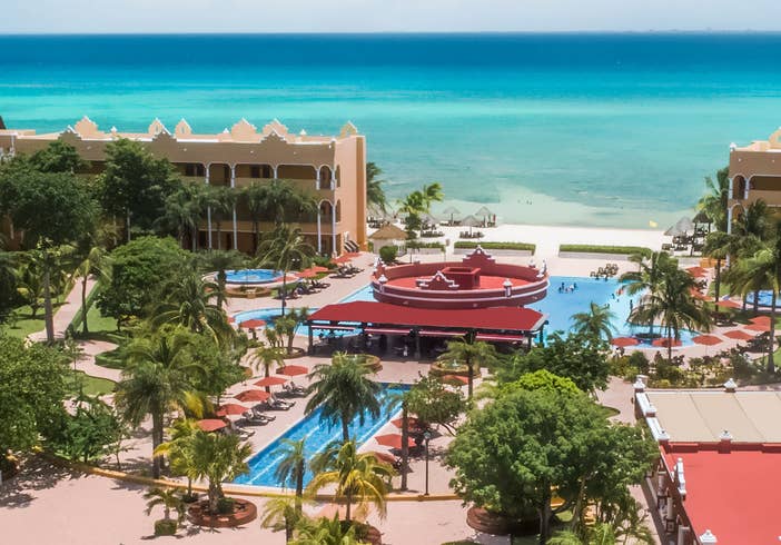 Aerial view of resort villas, outdoor pools and the ocean at The Royal Haciendas in Playa del Carmen, Mexico.