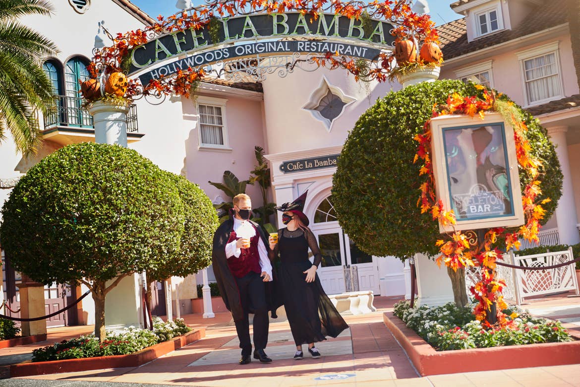 Guests exit Cafe La Bamba in spooky costumes with themed Halloween food and beverage.