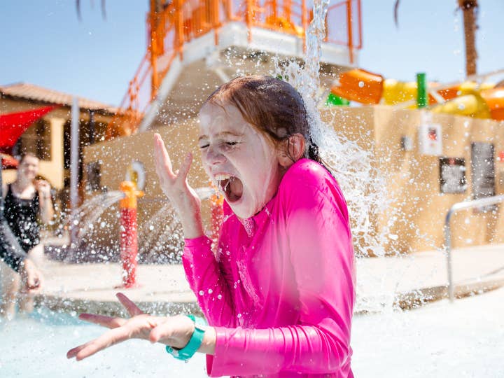 Young child playing at Splash Canyon waterpark at Scottsdale Resort in Scottsdale, Arizona.