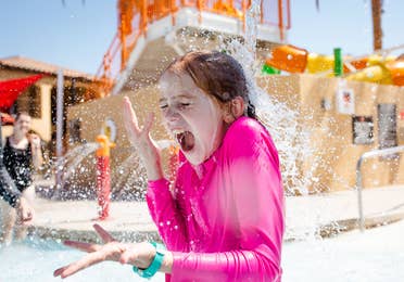 Young child playing at Splash Canyon waterpark at Scottsdale Resort in Scottsdale, Arizona.