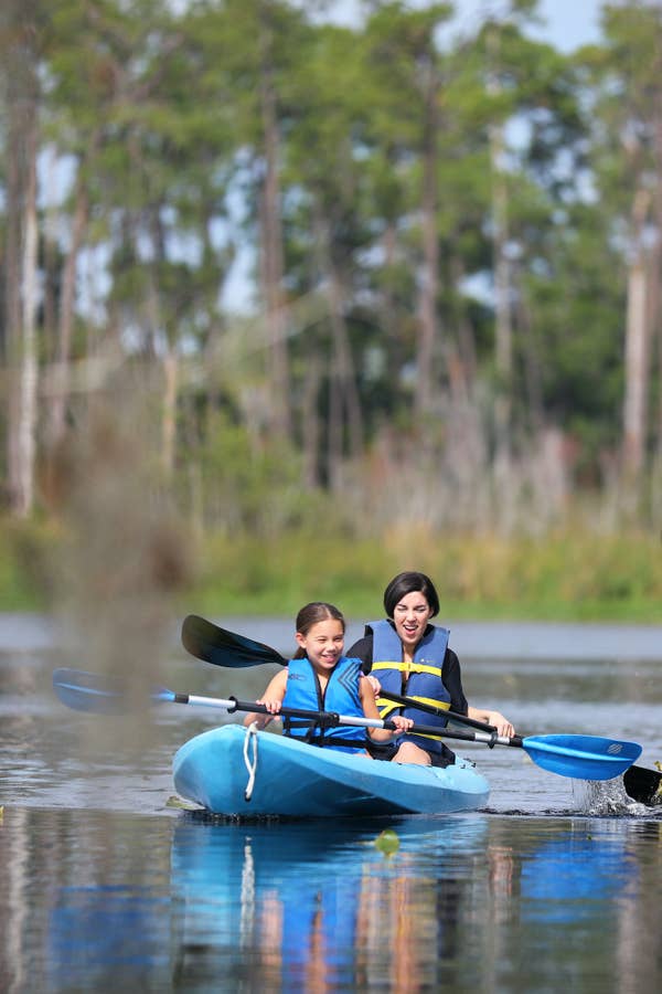 Adult and child kayaking at Orange Lake Resort near Orlando, Florida.
