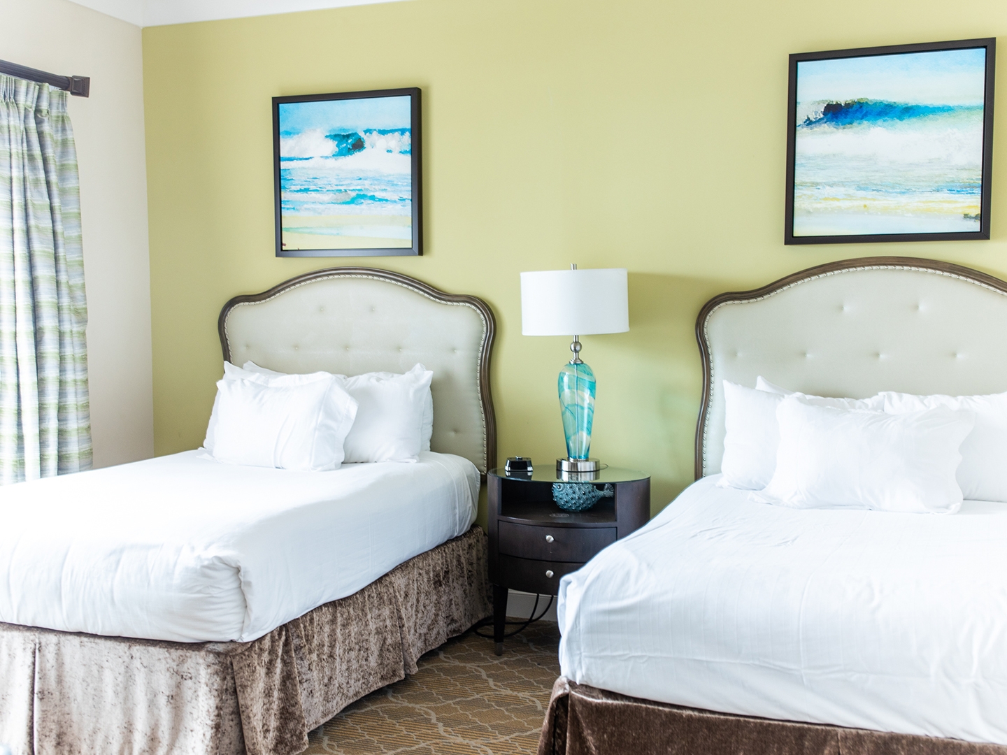 Two beds in a bedroom in a four-bedroom Signature Collection villa at South Beach Resort in Myrtle Beach, South Carolina.
