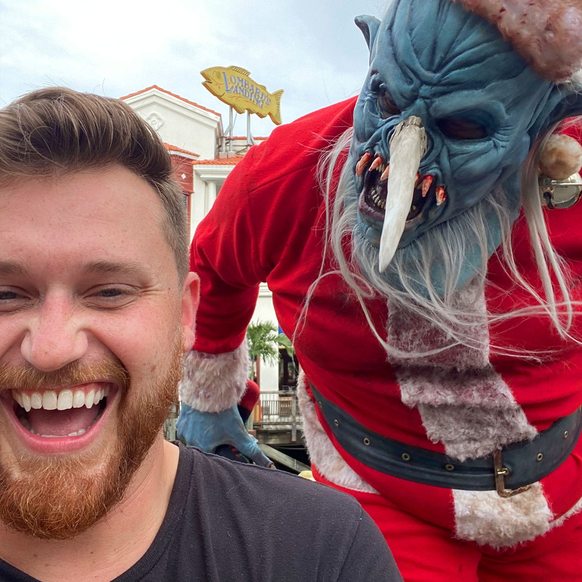 A man is confronted by a 'Demon Santa' performer.