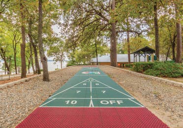 Outdoor shuffleboard court at Lake O' the Wood Resort in Flint, Texas.