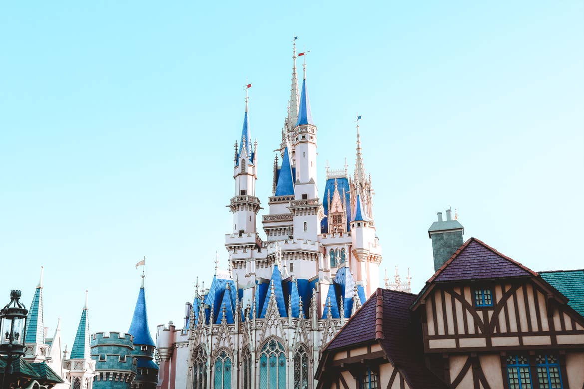 Cinderella's Castle at Magic Kingdom Park at Walt Disney World® Resort under a blue sky.