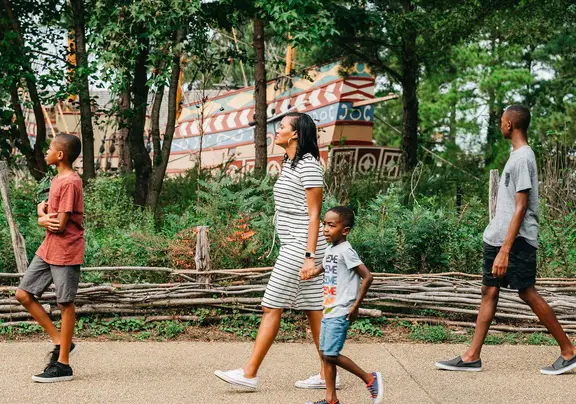 Family of four exploring Williamsburg near Williamsburg Resort in Virginia.