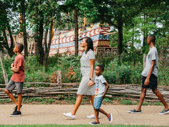 Family of four exploring Williamsburg near Williamsburg Resort in Virginia.