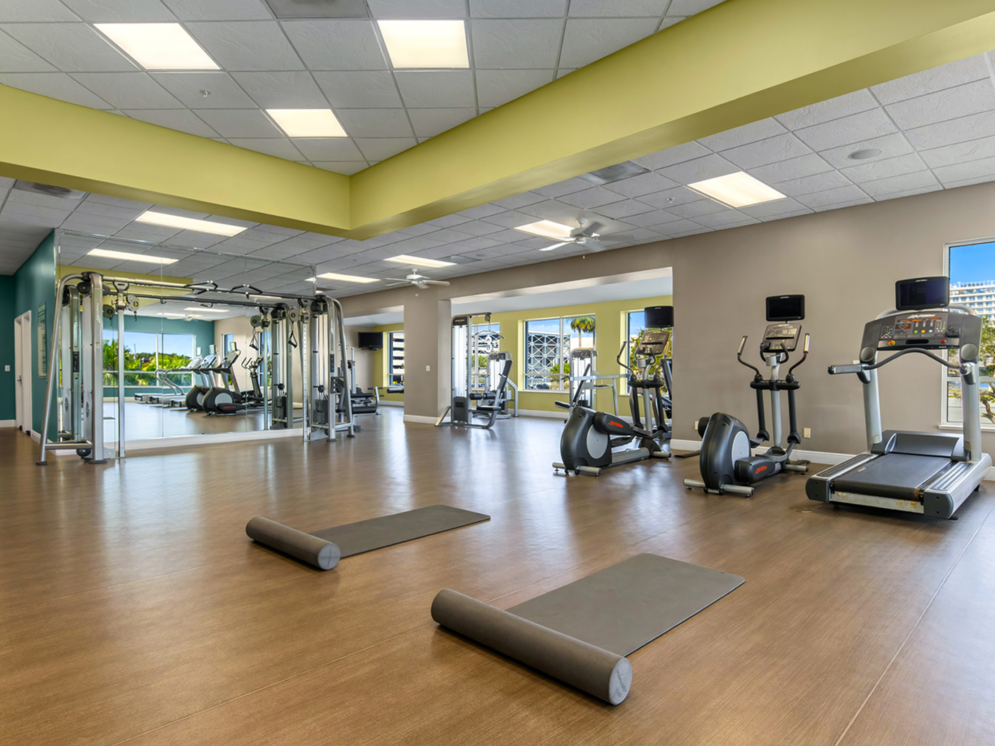 Fitness center with treadmills, elliptical machines, and weight machines at Cape Canaveral Beach Resort