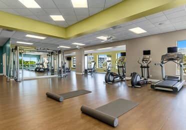 Fitness center with treadmills, elliptical machines, and weight machines at Cape Canaveral Beach Resort