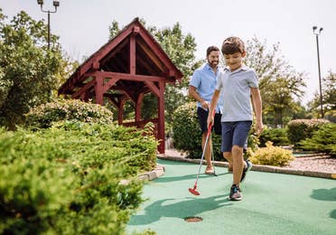 family playing mini-golf at Ripley’s Believe It or Not!® Williamsburg near Williamsburg Resort, VA.