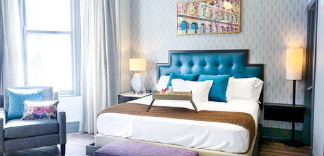 Queen bed at New Orleans Resort in Louisiana.