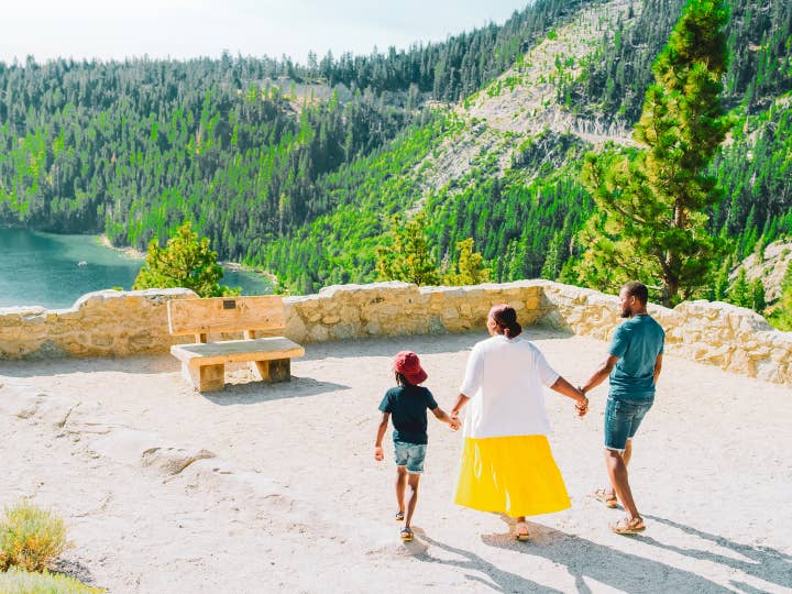 Family walking toward a lookout point.