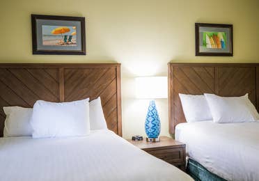 Bedroom with two beds in a two-bedroom villa at Cape Canaveral Beach Resort in Florida.