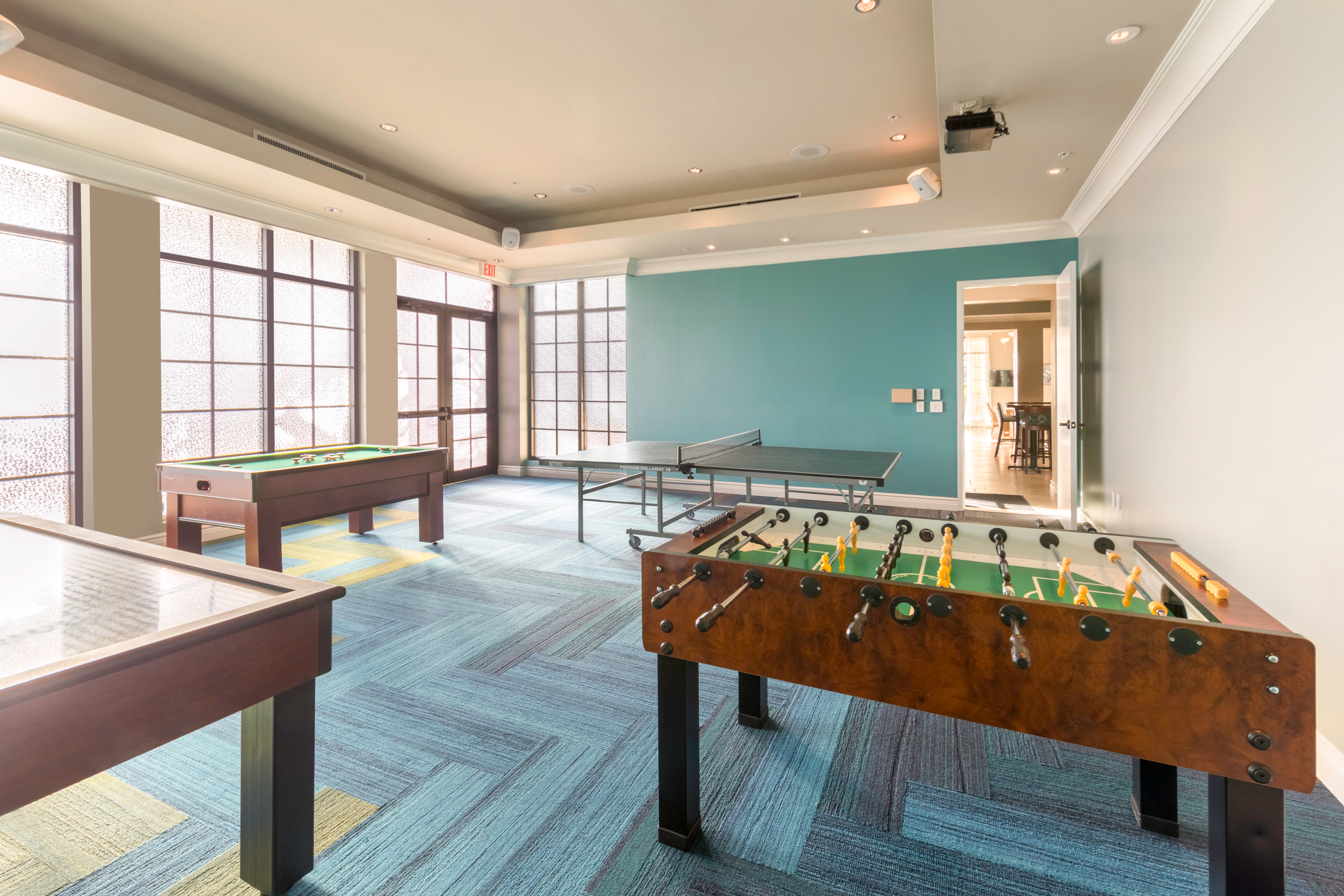 Game room with Foosball table and ping pong table at Sunset Cove Resort in Marco Island, Florida.