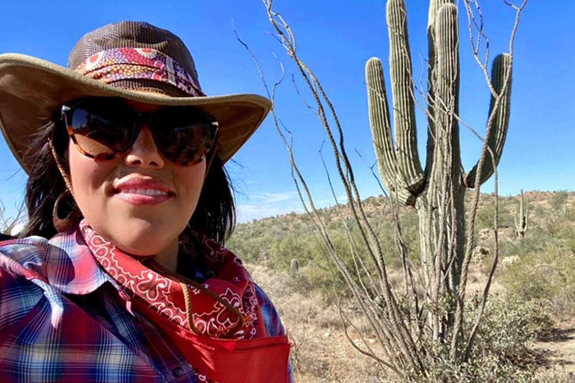 Team Member, Noemi, poses at the foothills at the Red Canyon in Scottsdale, AZ.