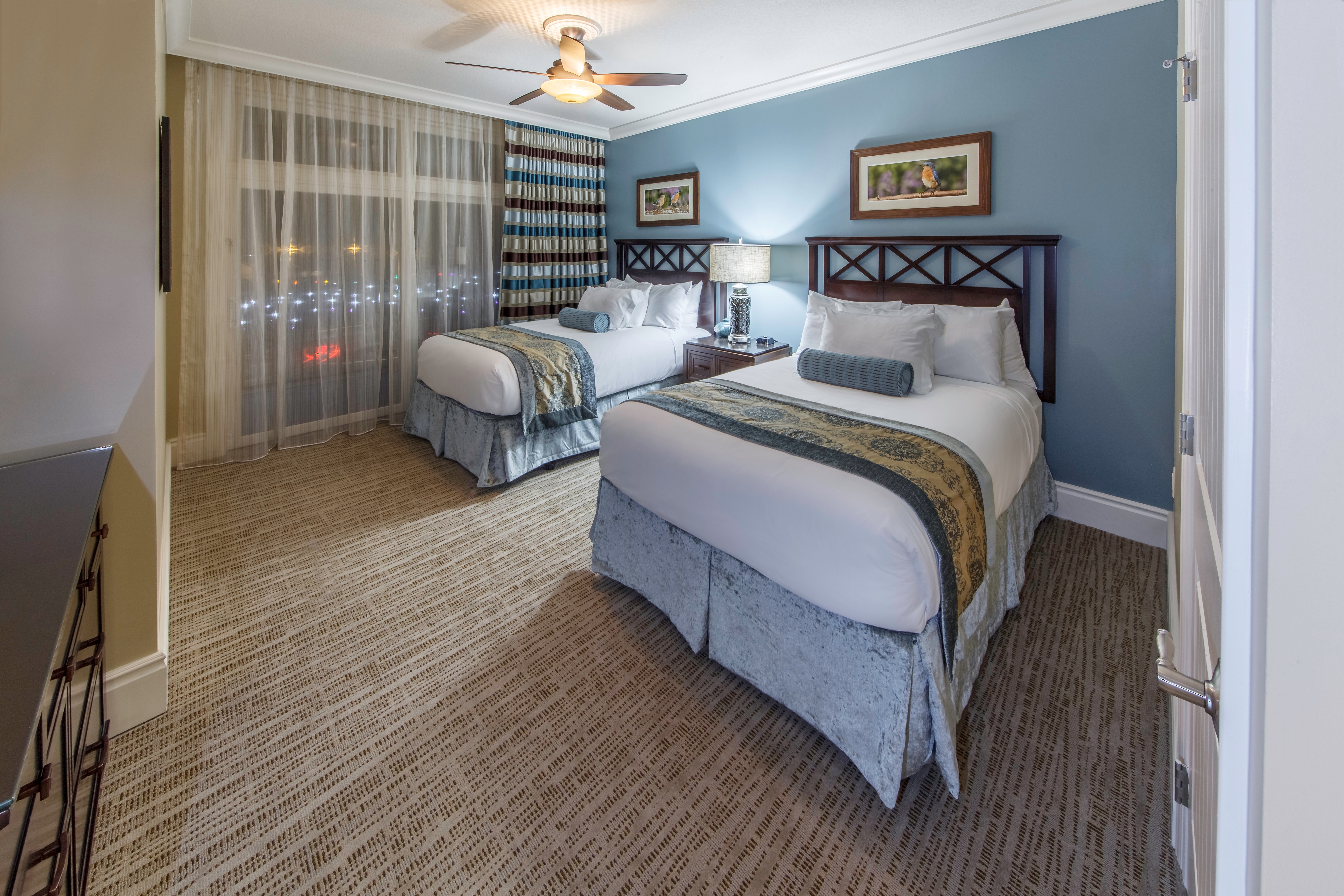 Bedroom with two beds in a Signature Collection Villa at Smoky Mountain Resort in Gatlinburg, Tennessee.