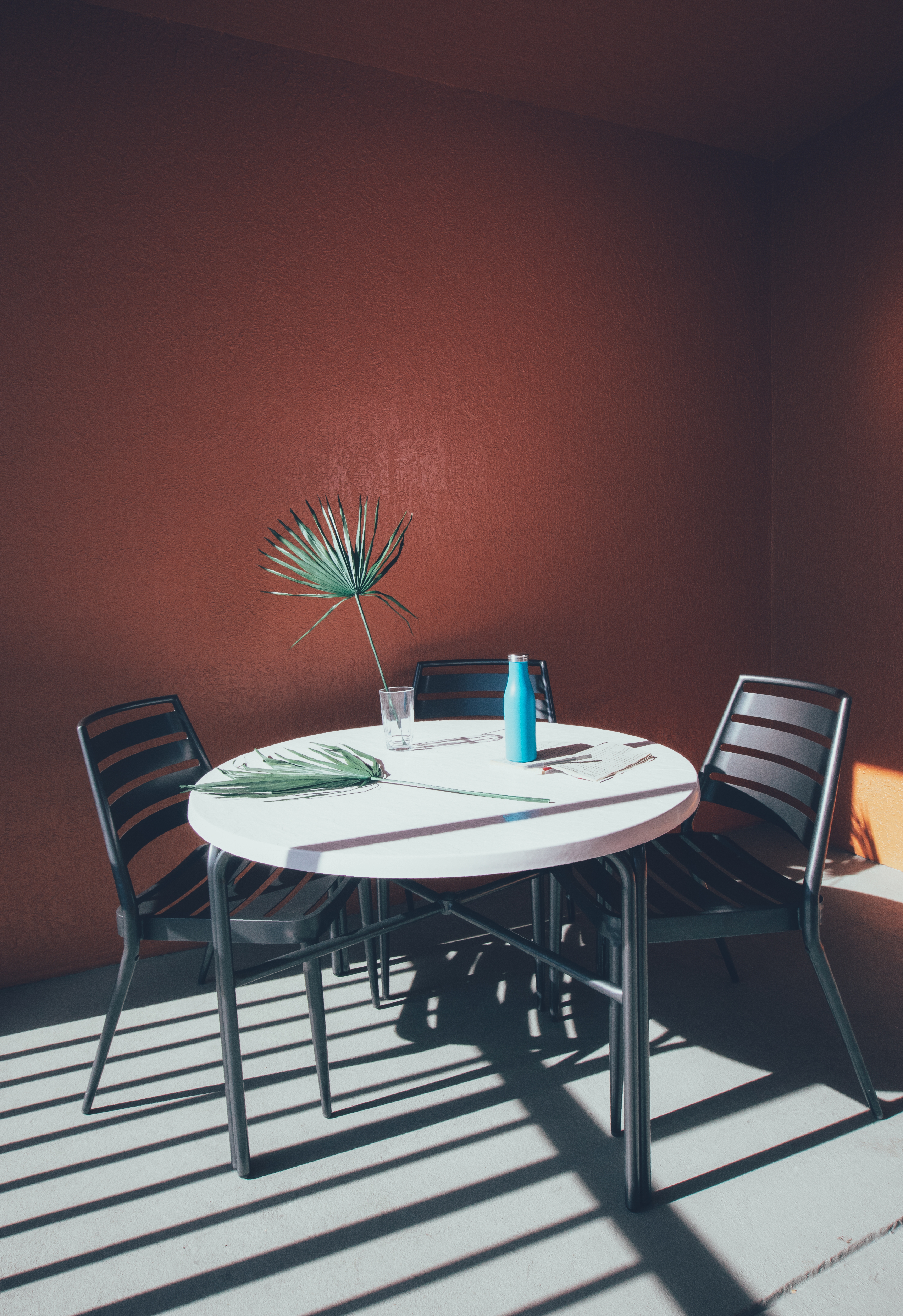 Furnished balcony with table and three chairs in a villa in River Island at Orange Lake Resort near Orlando, Florida