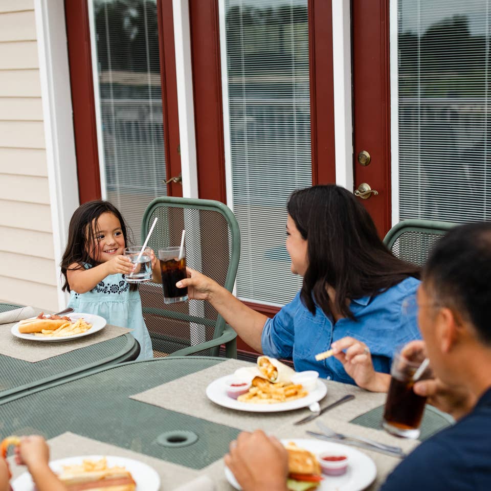 Family eating at Holiday Hills Resort in Branson, Missouri.