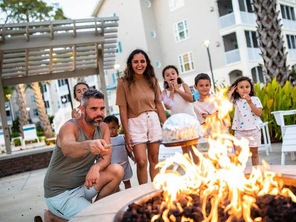 Family in front of fire place at South Beach Resort In Myrtle Beach
