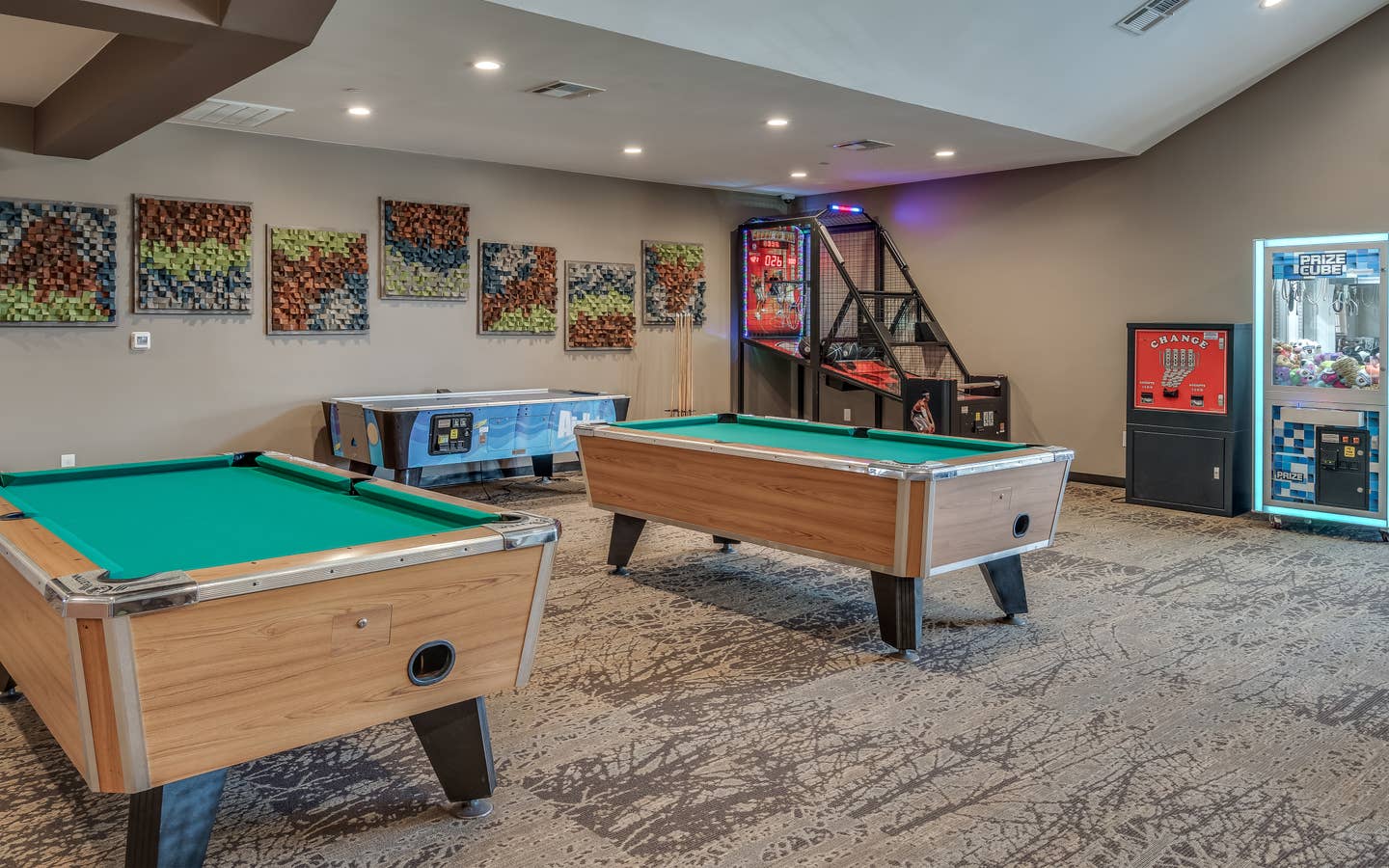 Game room with pool tables and air hockey at Piney Shores Resort in Conroe, Texas.