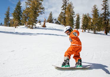 Children snowboarding at the activity center near Lake Geneva Resort, Lake Geneva, WI.